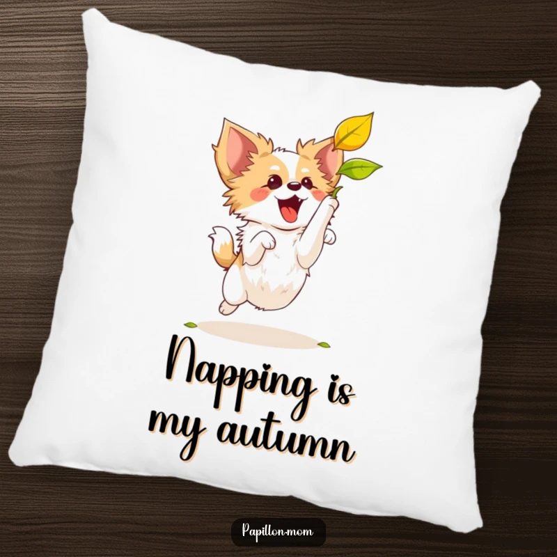 Funny Papillon dog in a playful leap to catch a leaf, presented on a plush, decorative pillow.
