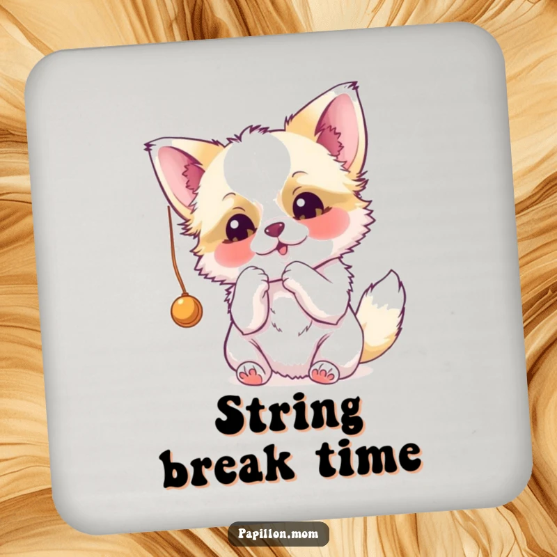 Funny Papillon drink coaster featuring a dog hilariously batting at a dangling string, adding a playful touch to any table.