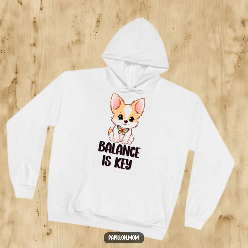 Funny Papillon dog hoodie showing a cute dog balancing a butterfly on its nose, perfect for cozy, humorous wear.